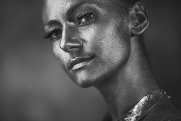 Black and white portrait of a model with shining face