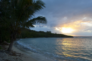 Fototapeta na wymiar Sunset over a tropical ocean bay