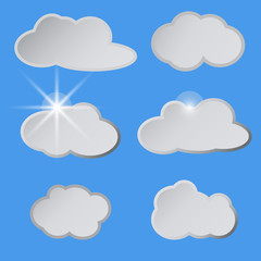 Obraz premium Stylized white clouds in the blue sky, the sun.