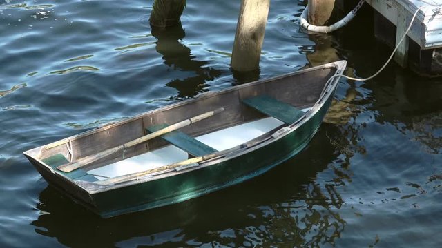 Rowboat floating in water