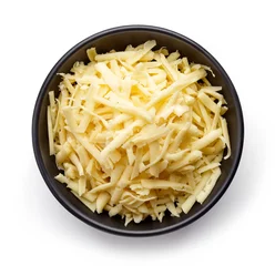 Tuinposter Bowl of grated cheese from above © bigacis