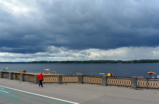View on the Volga quay of the Samara city in anticipation of thunderstorm. City embankment, beautiful sky with cumulus clouds before rain at cloudy autumn day