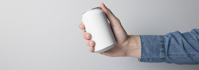 Blank Can in hand on white background, ready to replace your design