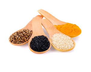 Cereal grains , seeds, beans in spoons on white background