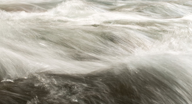rough water in the mountain river water as a background