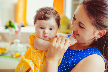 beautiful young mother looks at her newborn baby