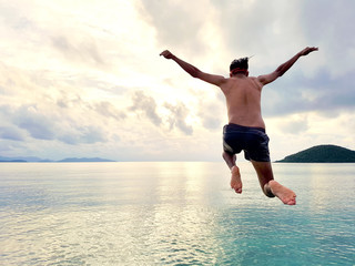 Cliff Jumping into the Ocean at Sunset, Summer Fun Lifestyle