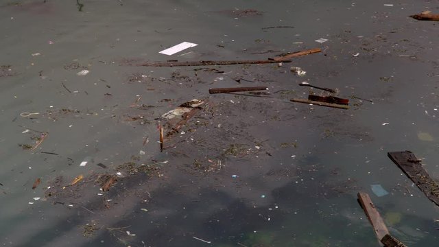 Panning shot of dirty polluted water