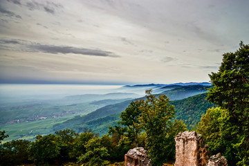 Beautiful mountains landscape from the top of the hill with fog