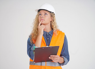 Cute female apprentice engineer pondering her project