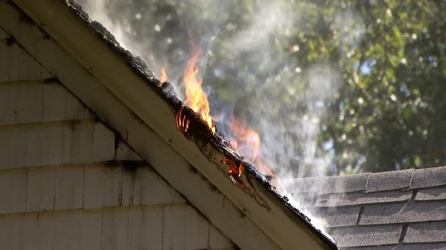 Close up of house roof fire