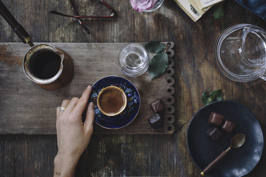 Woman holding cup of coffee 
