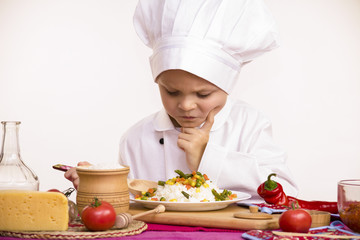 boy chef cooked cheese with vegetables