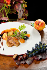 Fine dining, roasted Foie gras with brown rice and dry fruit © Visionsi