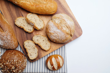 Loaf of bread on wooden background, food closeup...
