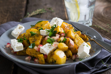 Salad with roasted sweet potato, feta and pomegranate