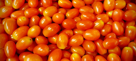 Red queen tomatoes background. Group of tomatoes