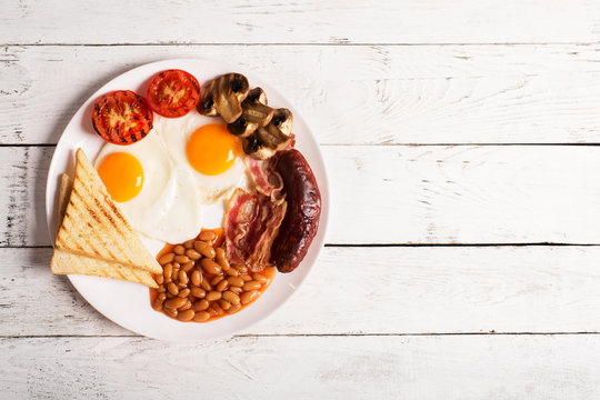 English breakfast on a white wooden table