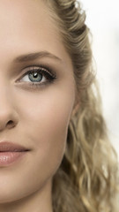 Obraz premium Close up portrait of beautiful blonde girl half face