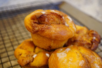 Pumpkin cinnamon rolls freshly baked in muffin tins