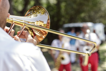 Fototapeta premium Hands of man playing the trumpet at outdoor