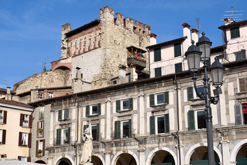 Fototapeta na wymiar The ancient Burnt Tower of Piazza della Loggia in Brescia