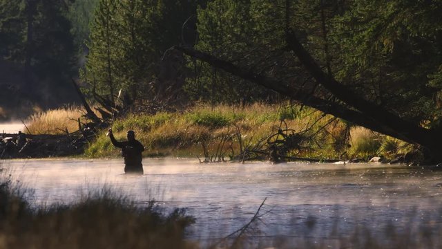 Fisherman fly fishing at Yellowstone National Park