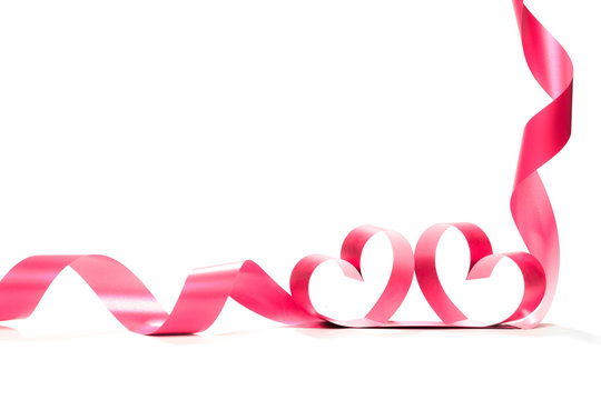 Ribbons shaped as hearts on white