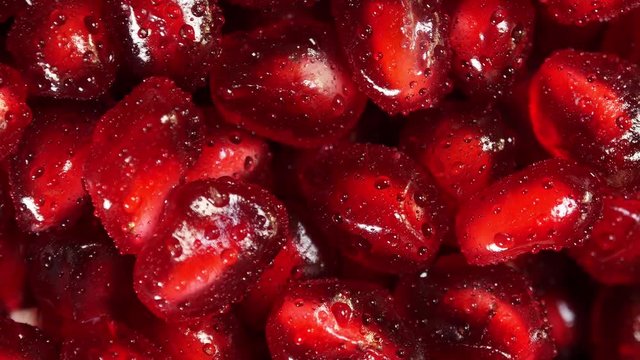 Rotating fresh pomegranate seeds for food