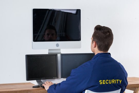 Security officer using computer