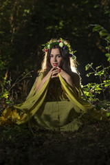 Obraz na płótnie Canvas Fantasy Fairy Tale Forest , young woman posing as nymph