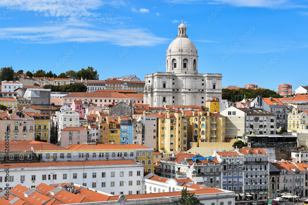 Poster Cityscape from port of Lisbon with beautiful view over historical buildings and famous Dome of Santa Engracia with blue sky background.