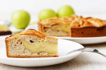 Homemade apple custard pie on white table
