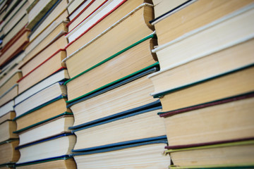closeup the wall of books on library shelves