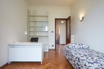 Bedroom interior with single bed in normal apartment