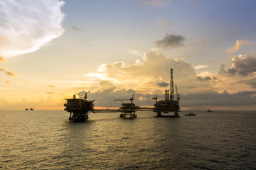 Fototapeta premium Silhouette of oil rig or platform at oilfield in Malaysia