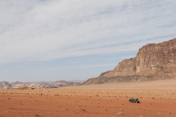 Fototapeta na wymiar Jordan Wadi Rum Desert with off-road vehicle