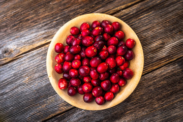 Fresh cranberry on wooden background