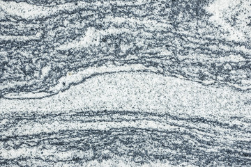 Grainy gray white mineral granite background.