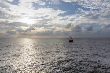Obraz premium A single anchor handling tug floating at oilfield Malaysia in the morning.