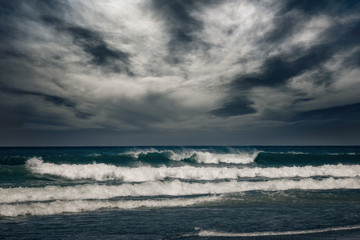 Fototapeta na wymiar Stormy ocean landscape with rainy clouds