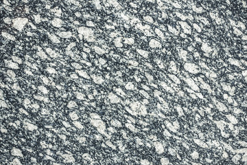 Grainy gray white mineral granite background.