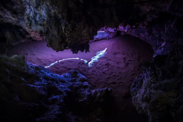 Big Azishskaya cave with speleothem, stalactites, stalagmites and stalagnates