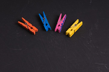 background with multi-colored wooden clothespins with patterns zigzag