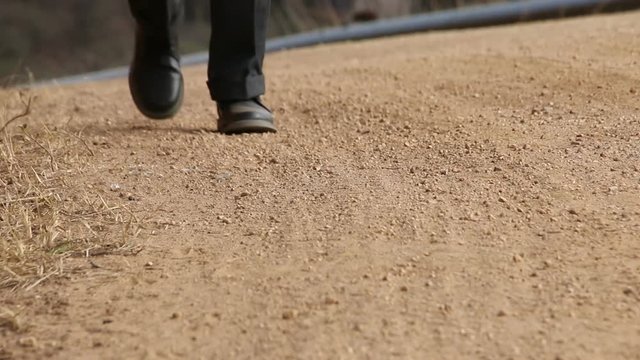 Close Up Of Young Smartly Dressed African Child Walking To School Along Rural Dirt Road In Kwazulu-natal In South Africa