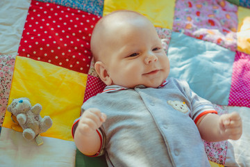 Funny kid on the coverlet