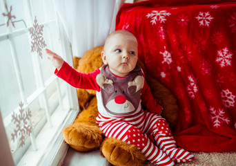 Little cute boy near the window