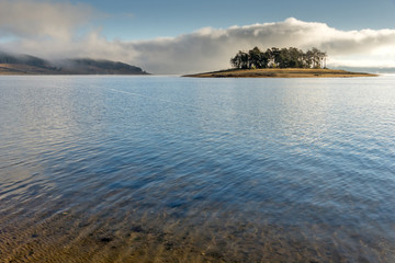 Island with pines in Batak Reservoir, Pazardzhik Region, Bulgaria