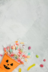 Halloween orange bucket with candies and jujubes