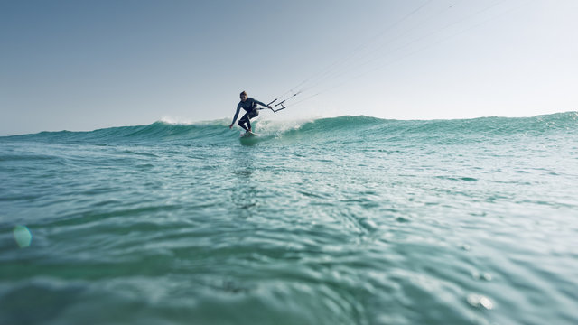 A woman kitesurfing;Tarifa cadiz andalusia spain